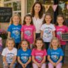 Maedcheneinschulung Mit Leherer Vor Schulhaus Mit Schoenem Tshirt Kita Abgaenger Schulkind